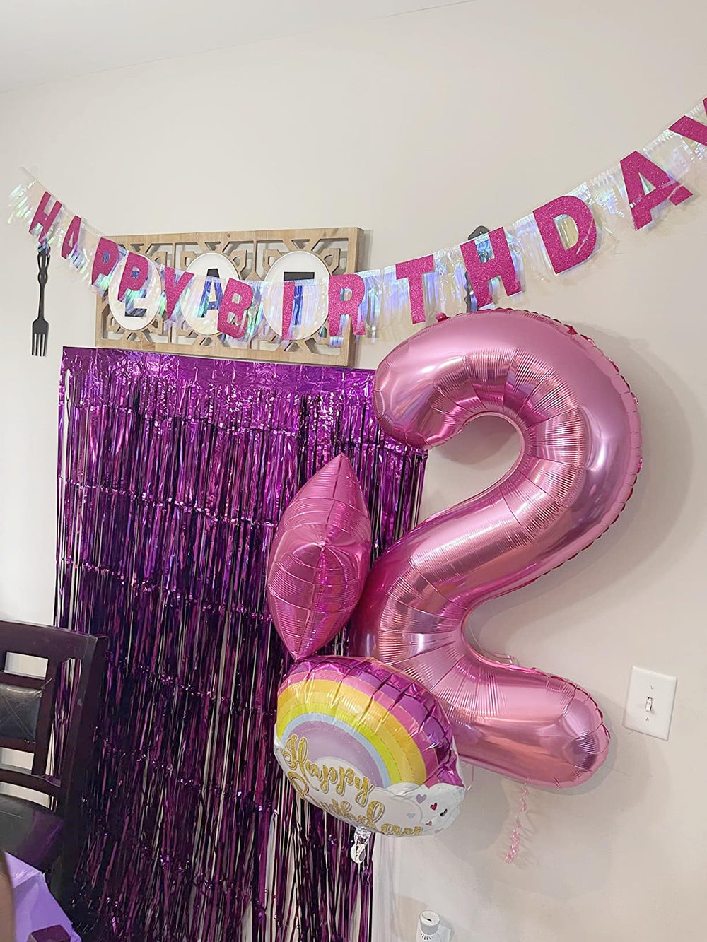 Mluchee pink 40-inch 4-number balloon arranged as a birthday display