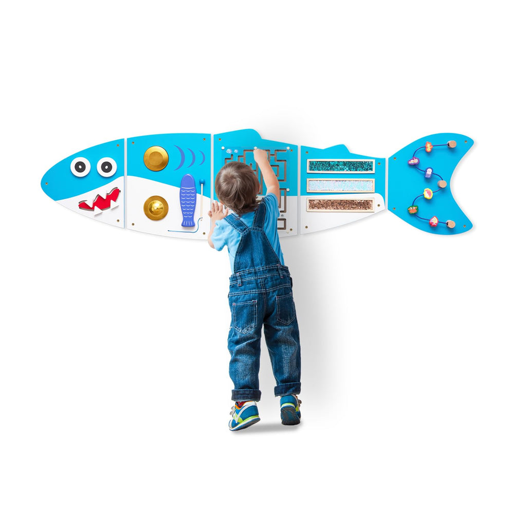 Monläurd Shark Busy Board panel for early motor skills and sensory exploration.