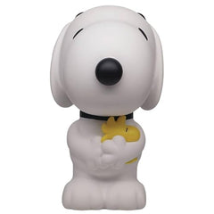 Monogram Snoopy figure bank side angle showing PVC texture and charm.