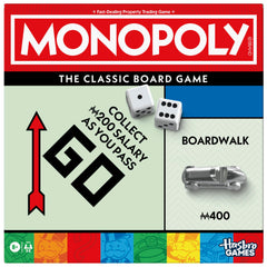 Monopoly board game with storage tray keeps cash and cards organized during play.