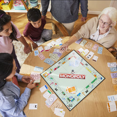 Monopoly family game night scene captures players trading and cheering