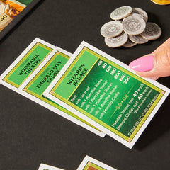 Monopoly Wicked Edition emerald castles space features property choices.