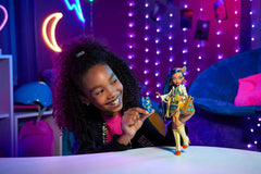 Cleo De Nile wears a royal blue dress to spark dramatic storytelling and display-worthy fashion.