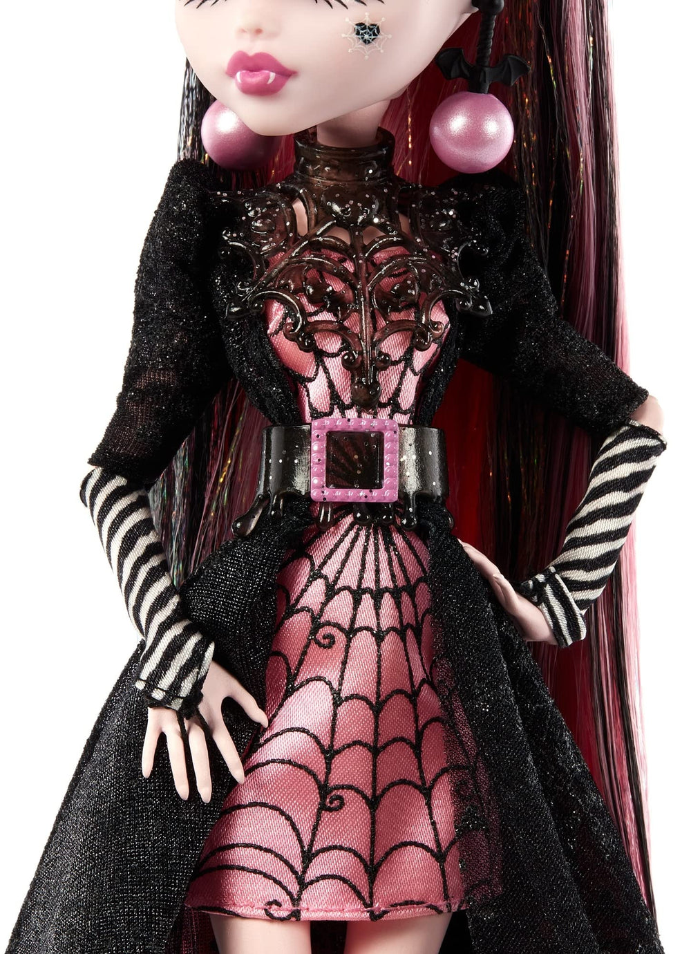 Monster High Draculaura doll with candy cane gloves and ornamental earrings for festive styling.