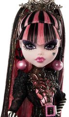 Monster High Draculaura doll wearing snowflake-motif coat for holiday display.