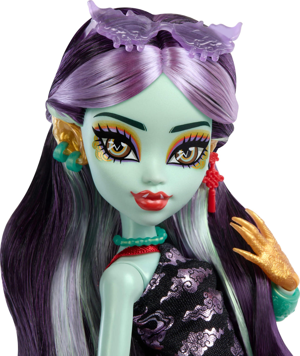 Monster High Jinafire Long doll with backpack for travel-ready adventures.