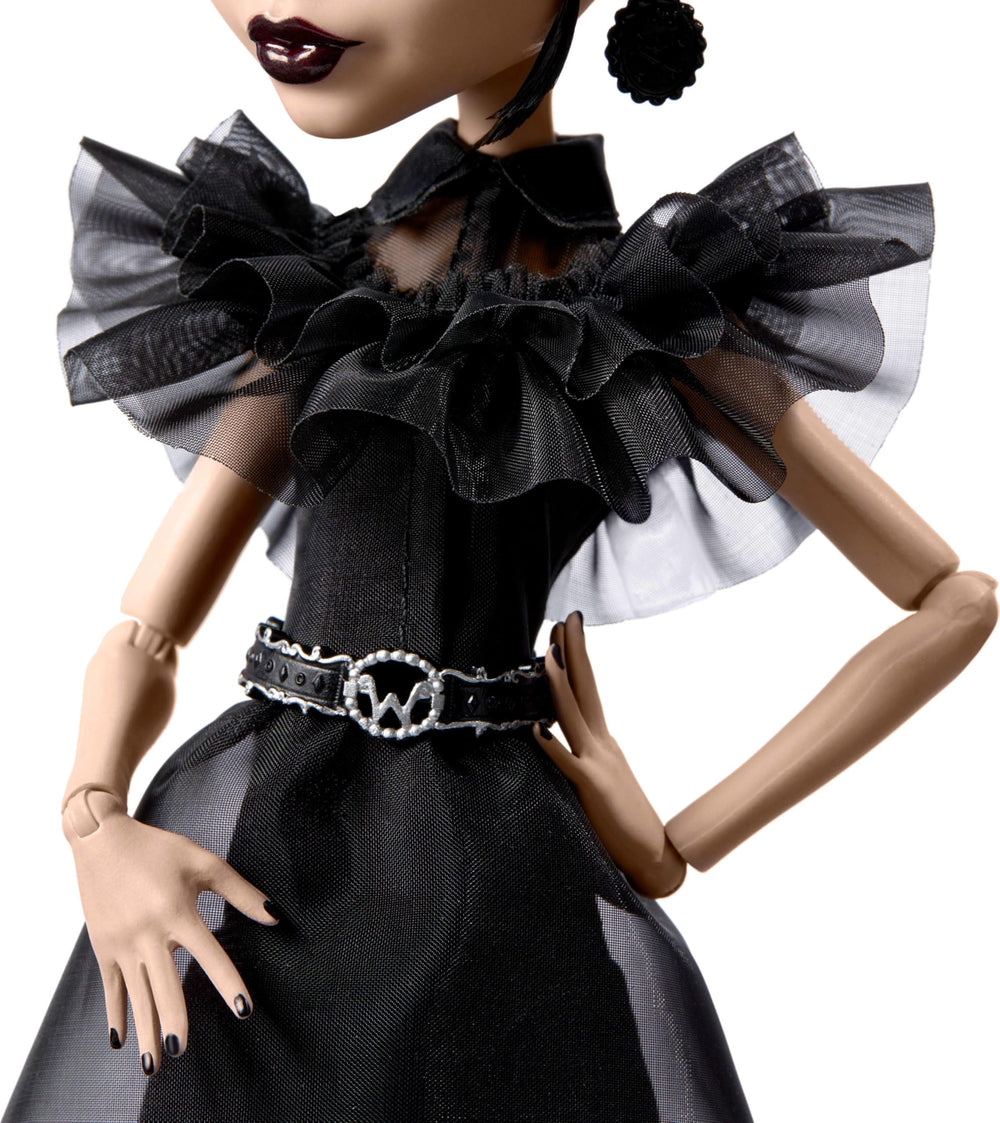 Monster High Wednesday doll showing belt and earrings for chic gothic styling.