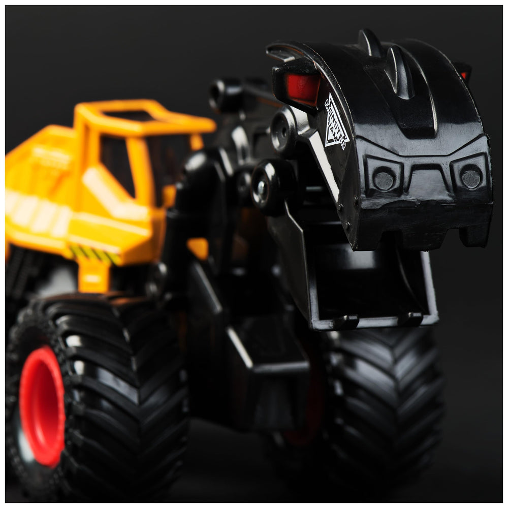 Axel dump-truck bed moves dirt for realism in play scenes.