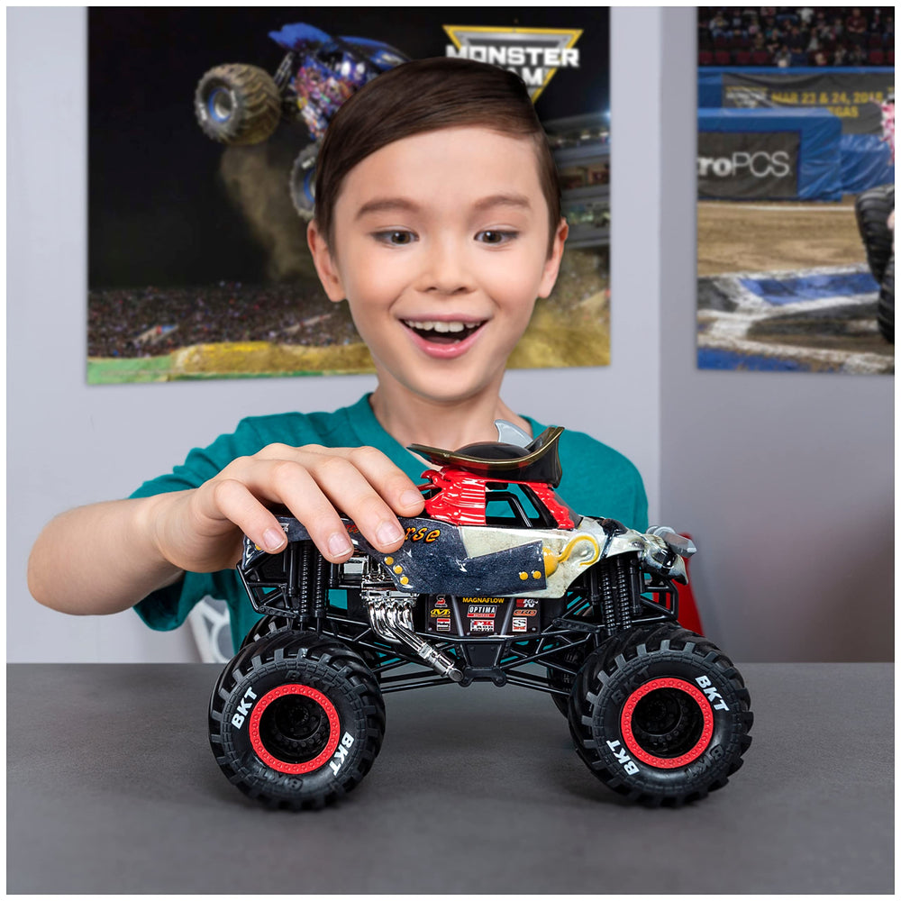 Monster Jam Pirates Curse Truck working suspension absorbs impact during play.