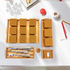 Montex wooden storage trays keep materials organized for focused math play.