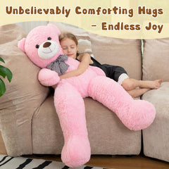 MorisMos pink giant teddy bear on a bed, comforting bedtime companion.