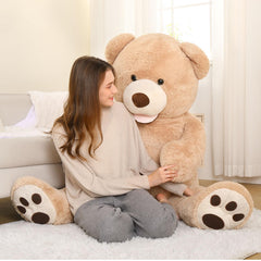 MorisMos life-size brown teddy in a cozy bedroom provides soft decor and comfort.