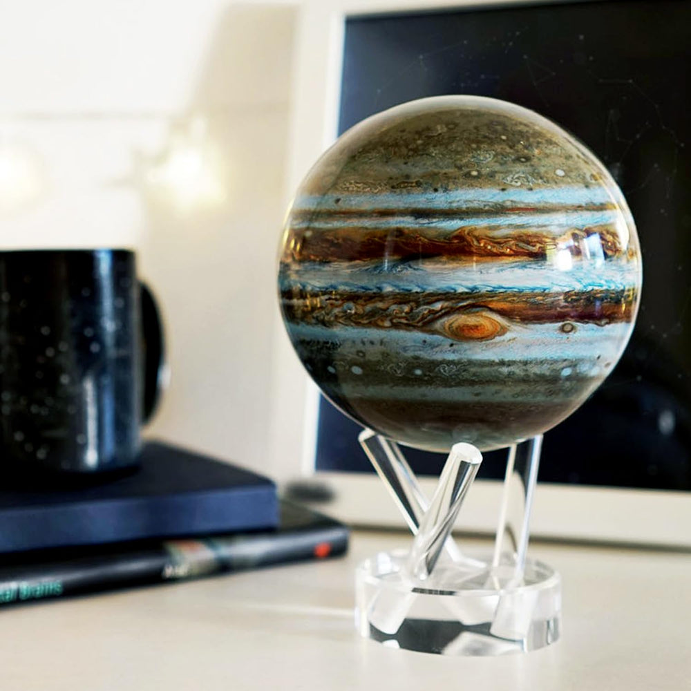 MOVA Jupiter Globe floats silently inside a clear shell for elegant shelf decor.