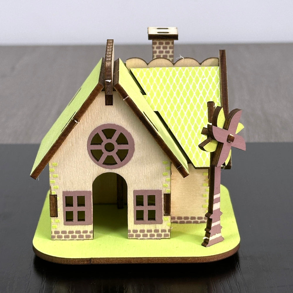 MPIUET green log cabin model emphasizes glue-free construction option.