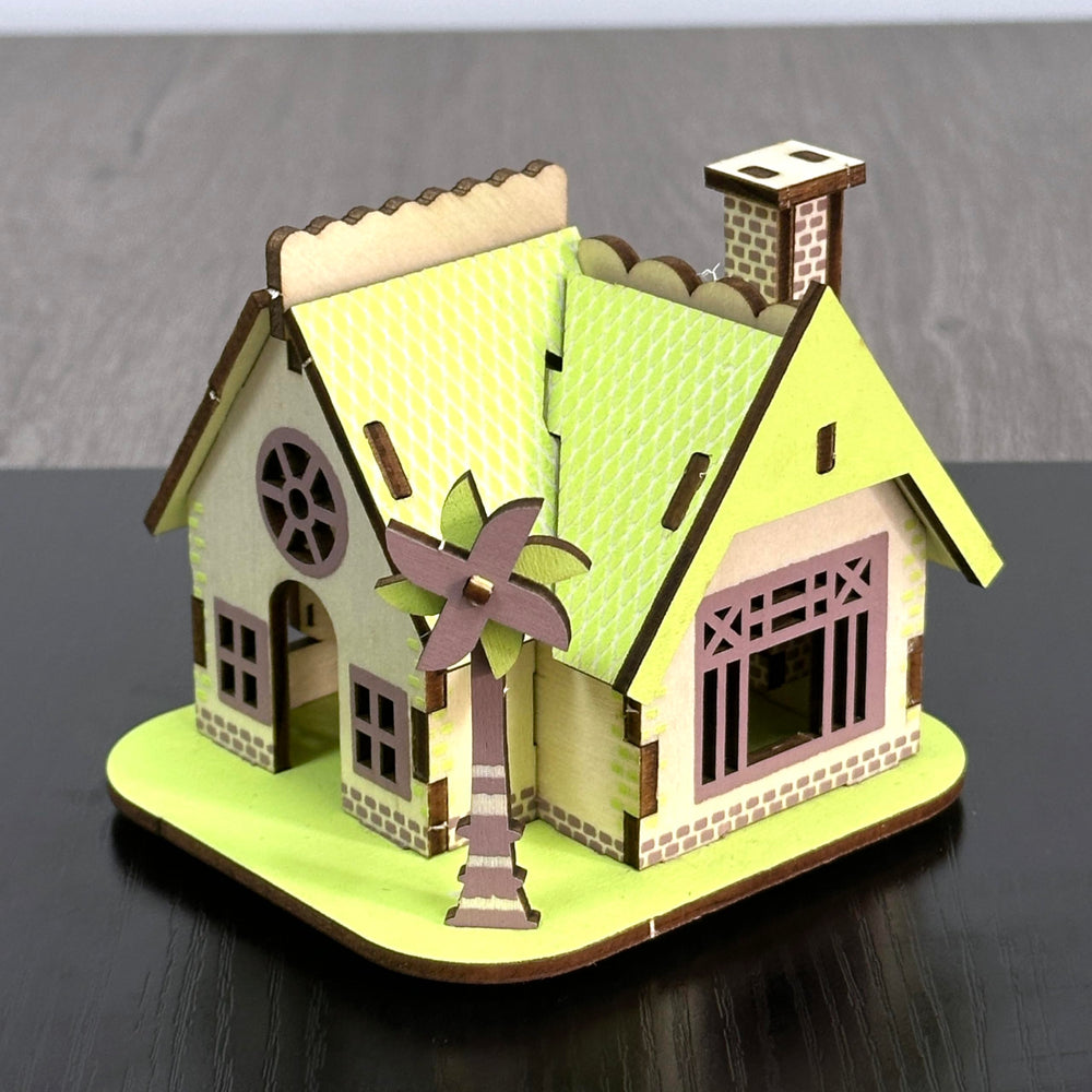 MPIUET green little house during construction highlights eco-friendly wood texture.