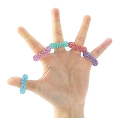 Mr. Pen rings in-hand demonstrating discreet stress relief fidgeting.