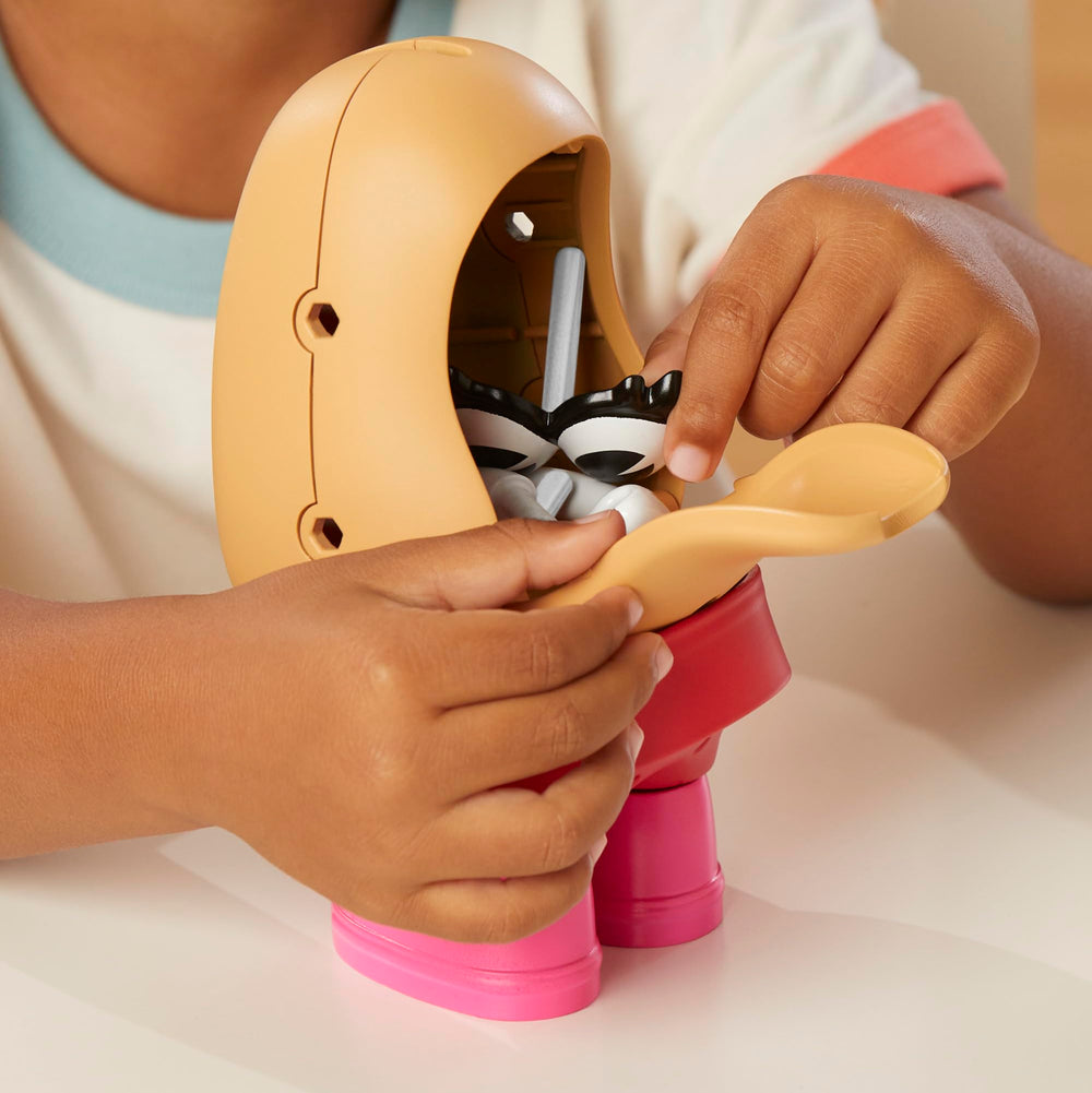 Mr. Potato Head accessories like skirt, hair, and shoes for dress-up play.