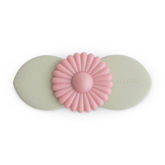 mushie Blossom suction spinner toy on bath rim for engaging water play