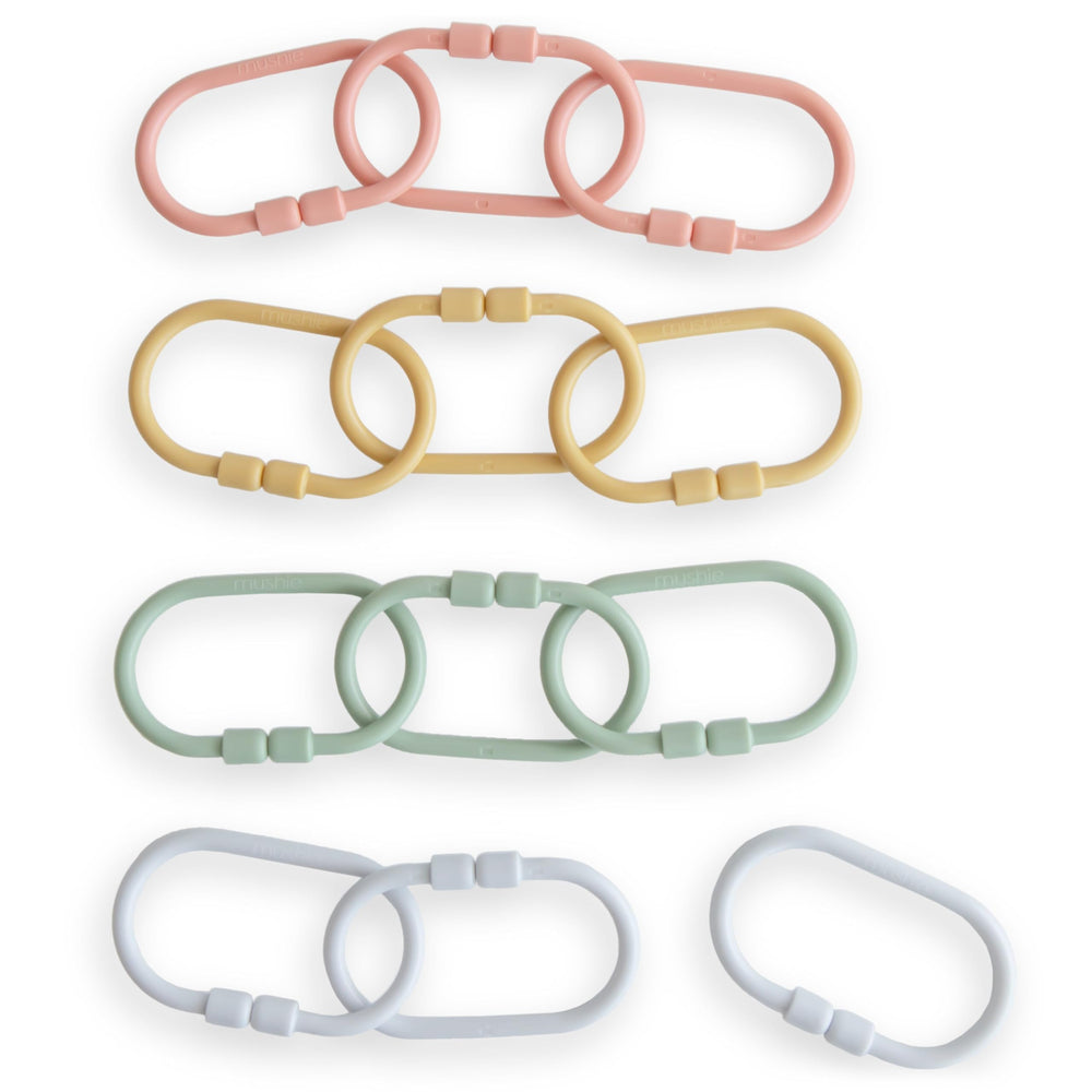 Mushie Chain Link Rings attach toys to strollers for easy reach during playtime.