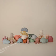 Mushie Dino Bath Toy opens into two pieces for easy cleaning