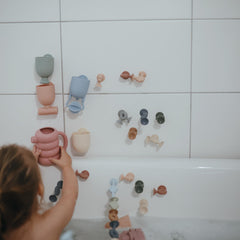 Mushie Pour and Play cup for easy water transfer
