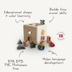 Mushie Shape Sorting Box Petal doubles as tidy toy storage.