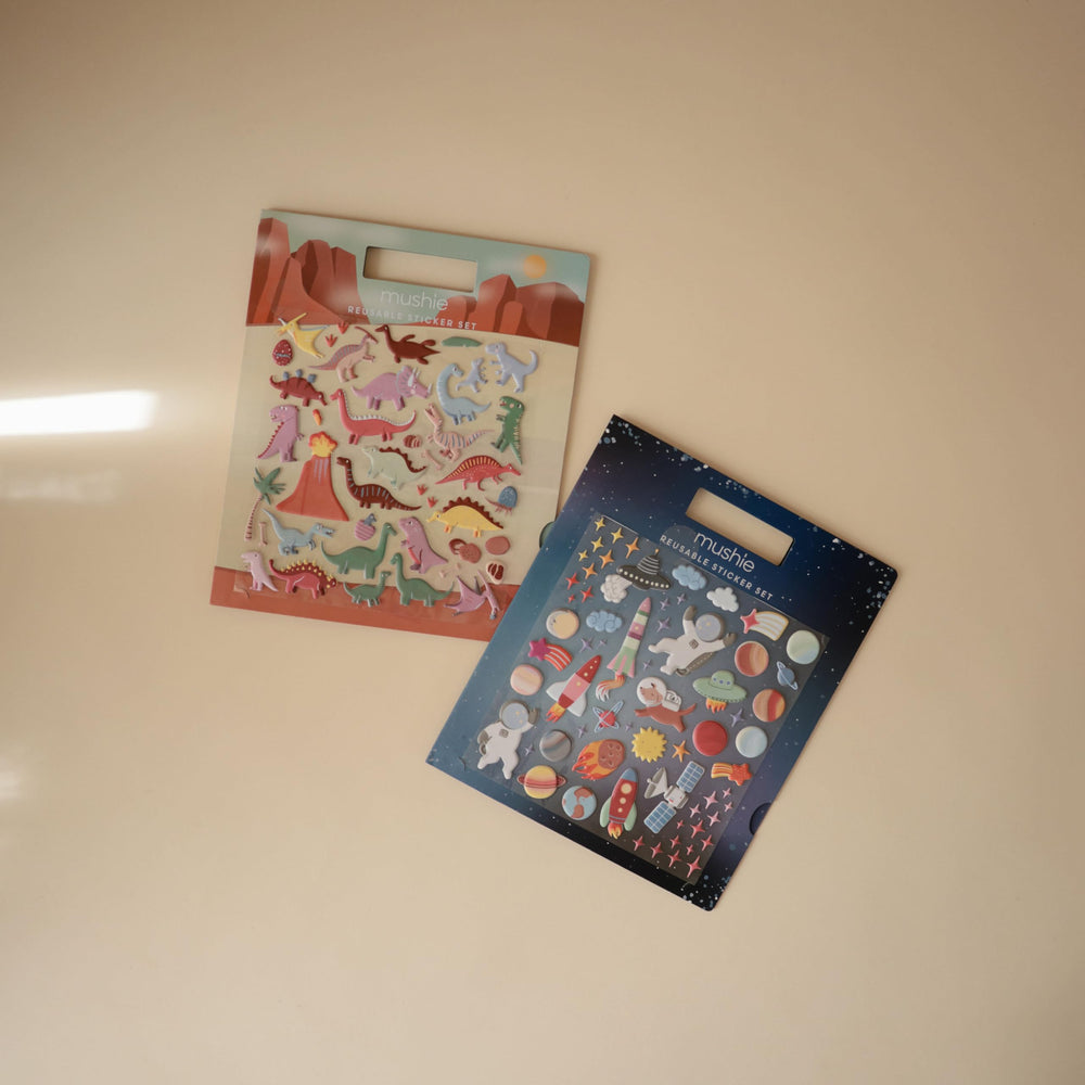 Mushie Space sticker book backs wipe clean for simple care.