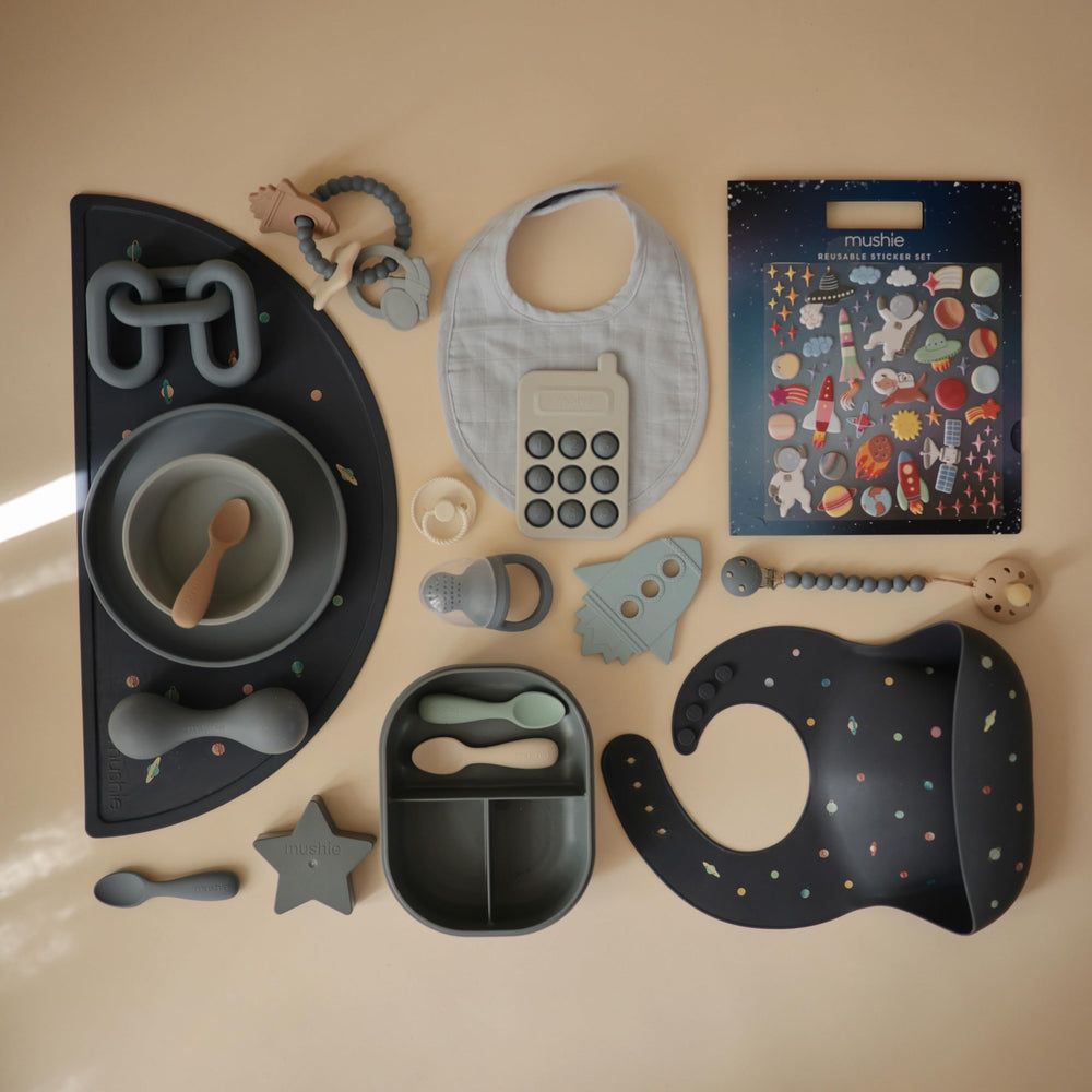 Mushie Space sticker set is travel-friendly for quiet car rides.