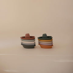 Stackable Mushie bath boats stored neatly after bath time