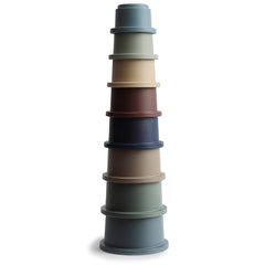 Mushie forest stacking cups set for safe, colorful play that encourages sorting and grasping.
