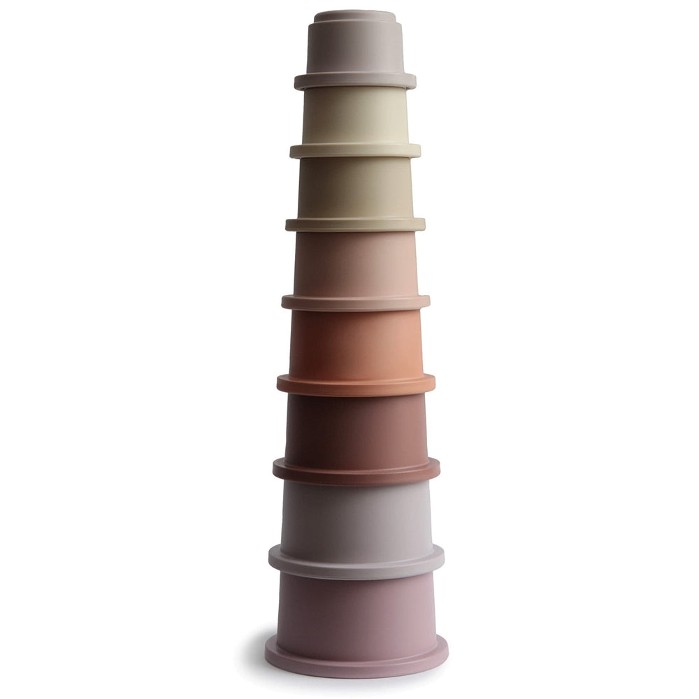 Mushie Stacking Cups Petal colors arranged in a bright tower to boost fine motor skills.