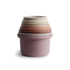 Mushie Stacking Cups Petal set shown in nested tower for easy storage and play.