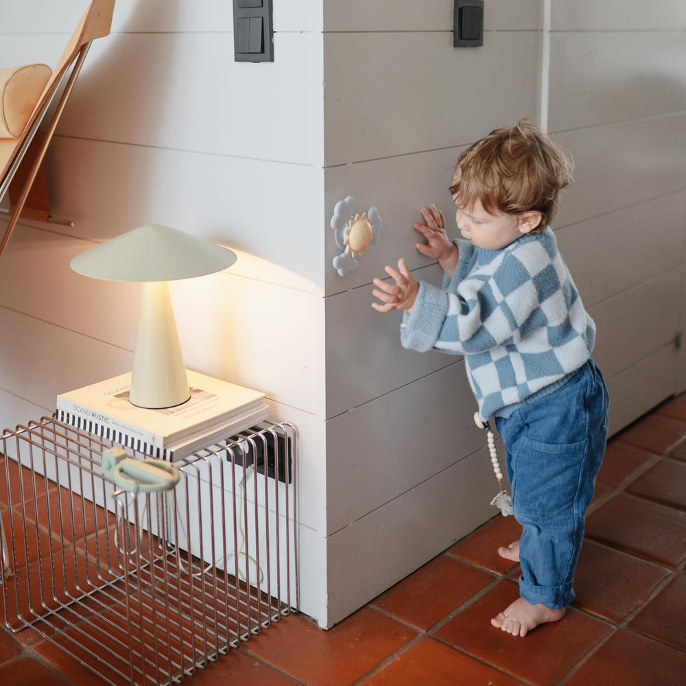 Mushie Sunshine suction spinner used during bath time for splash-free fun