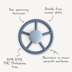 Mushie Wheel suction spinner toy with soft silicone leaves and dinosaur.