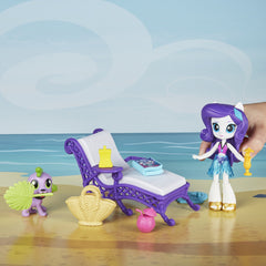 My Little Pony Spike dog figure joins adventures on sunlit shore.