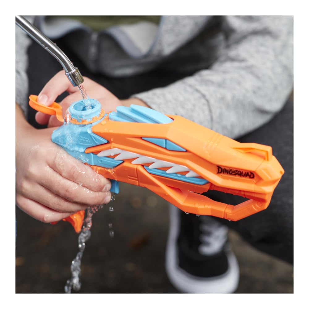 Nerf Dinosquad Raptor-Surge targeting a water-drenching stream on targets.