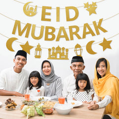 Bright gold glitter Eid Mubarak banner as a party backdrop feature