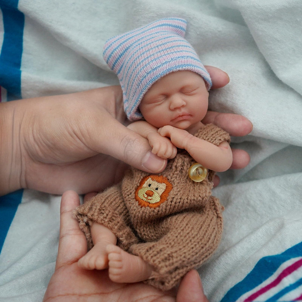 Newtotlove baby boy doll wearing clothing set for dress-up and nurturing role-play.