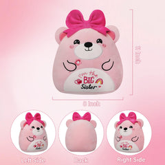 Pink bear with bow smiling for cuddling and playtime.