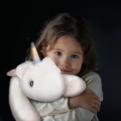 Niuniu Daddy unicorn weighted plush, side view, ideal for cozy bed time hugs.