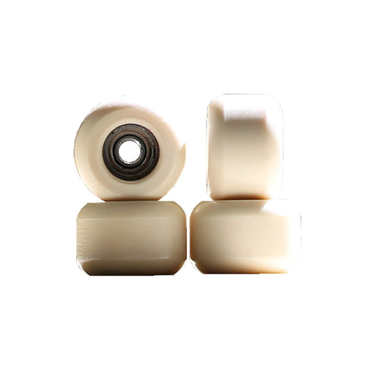 NOAHWOOD fingerboard beige-ii wheel close-up showing silent grip and smooth roll.