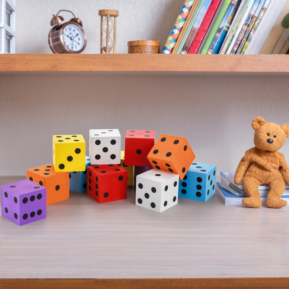 Noamus foam dice shown on a desk for organized learning.