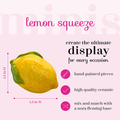 Nora Fleming hand-painted lemon mini adds a bright focal point to tables.