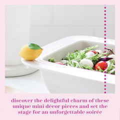 Nora Fleming lemon mini pairs with a base to gift-ready displays.