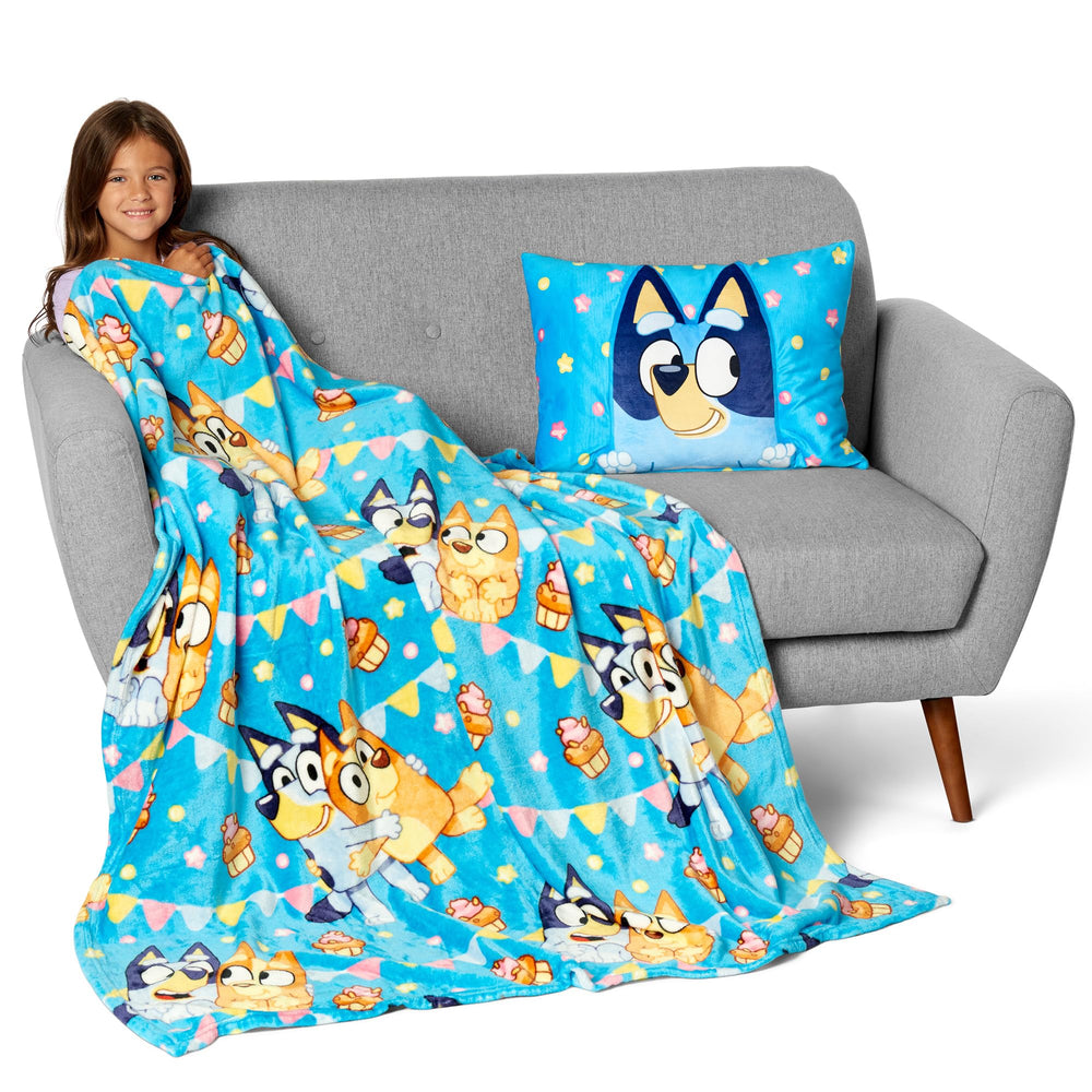 Northwest Bluey Party Pups folded blanket with pillow accent for sleepovers