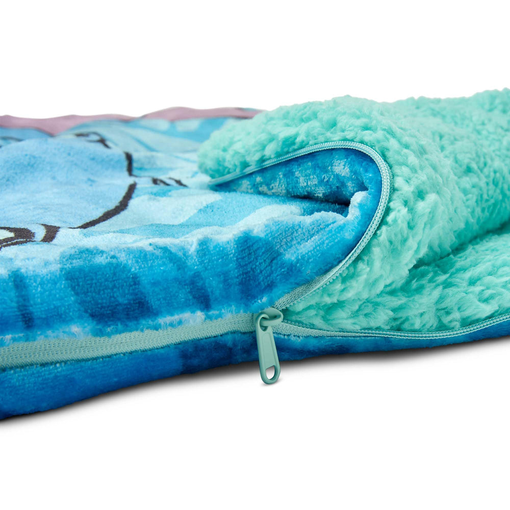 Northwest Lilo Stitch cloud sherpa slumber bag in cozy room setup suggests easy at-home comfort.