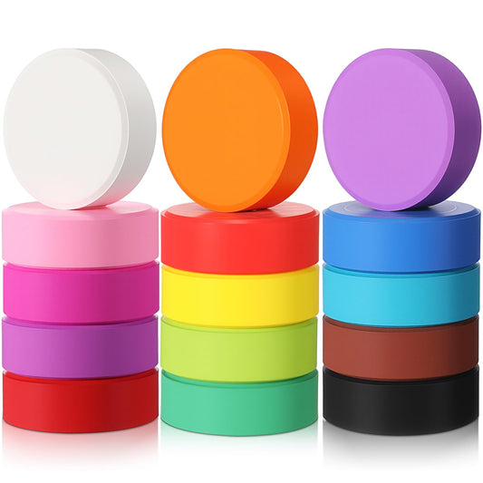 Nuanchu tempera paint cakes on desk with vibrant colors for classroom art.