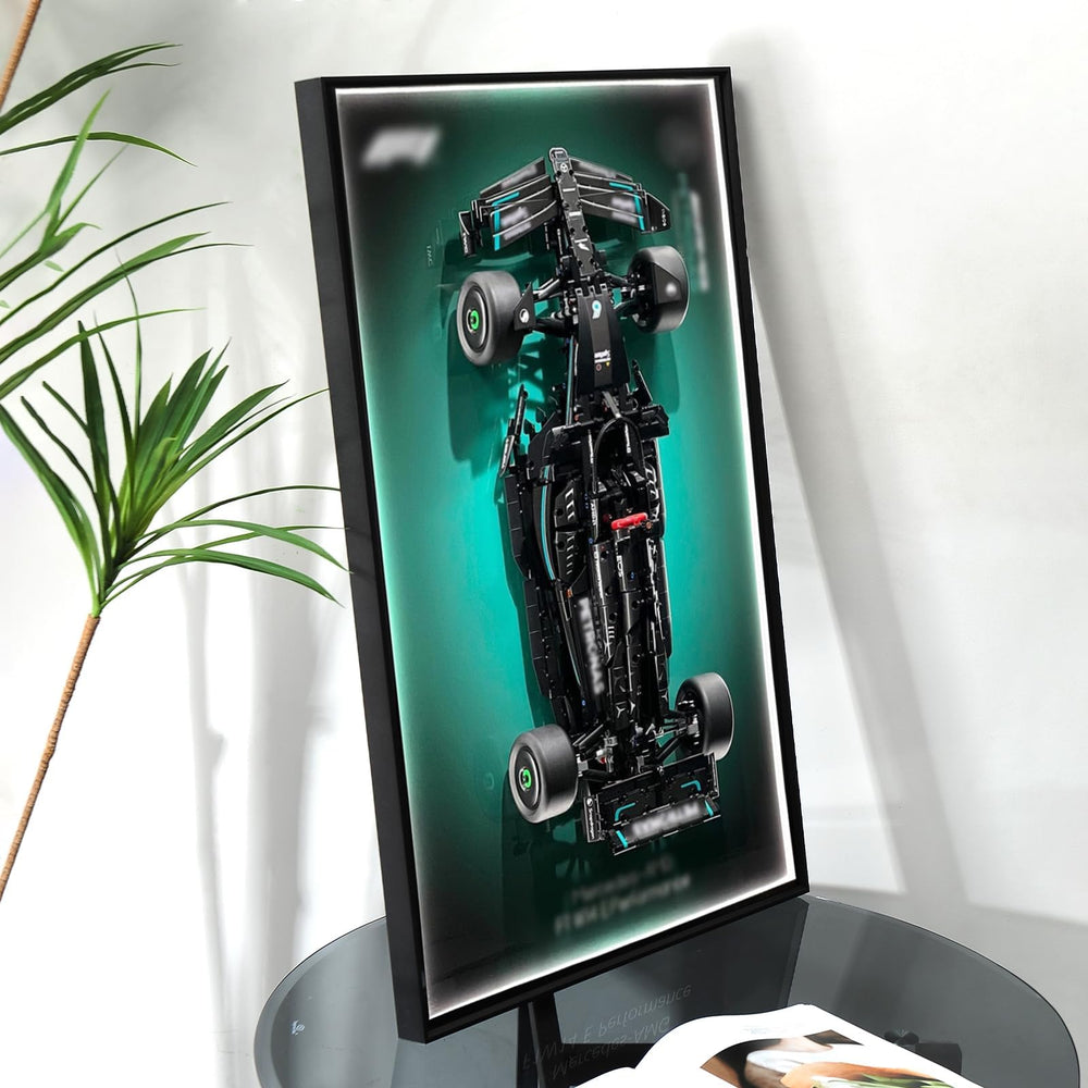 NyTfxkeJ wall-hanging frame elevates a Lego Mercedes F1 model.