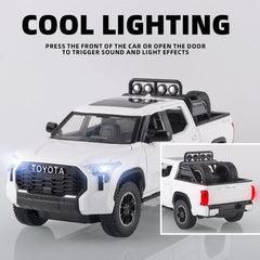OANMYJJO White Tundra diecast truck side view showcases working steering and movable wheels.