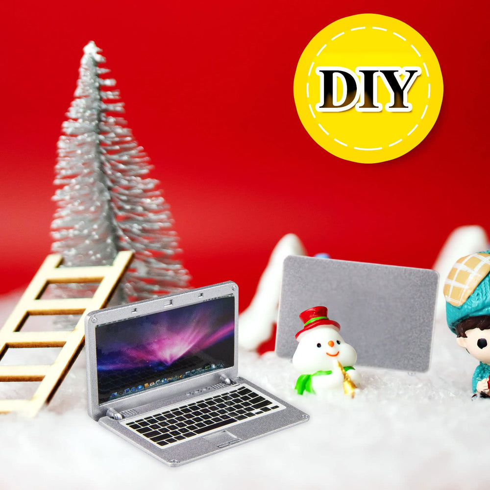 ODDIER dollhouse laptop metal body conveys sturdy miniature design.